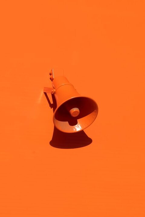 orange-megaphone-on-orange-wall-qrkjwe6yfjo